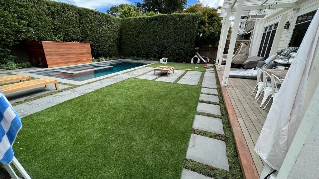 Synthetic turf and stepping-stone garden installed by Rosales